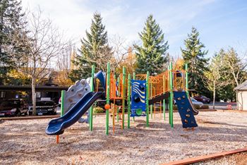 a playground with a bunch of slides on it